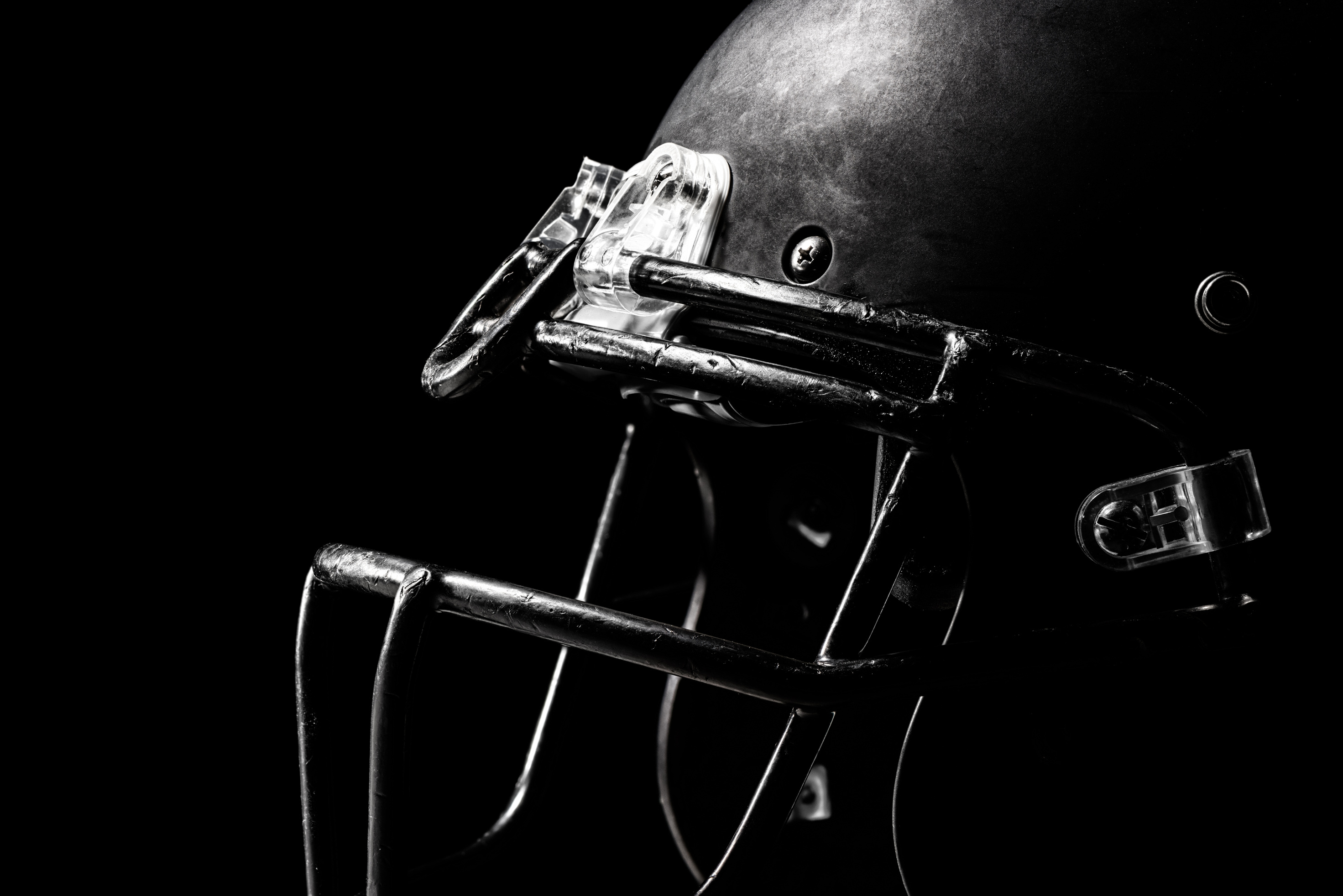 Football Helmet on Black Background.